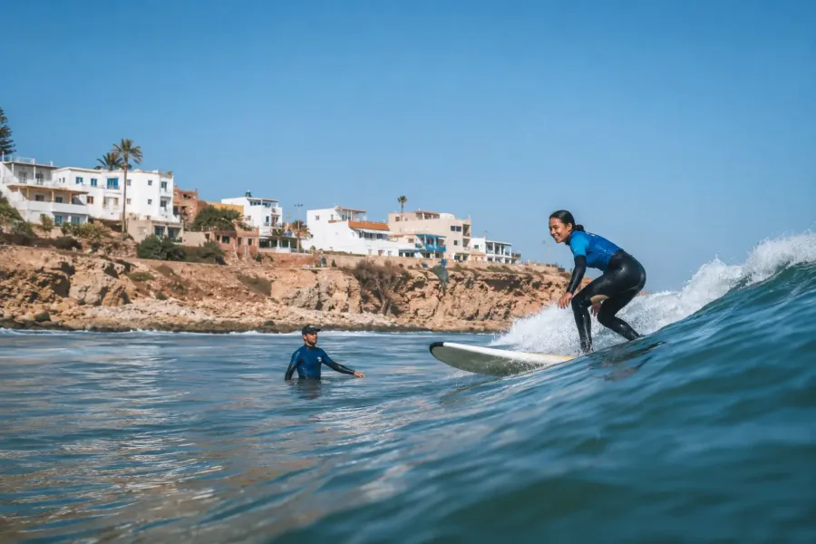 Beginner surfer riding an Atlantic wave near Taghazout and Agadir