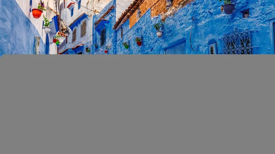 Quiet winding blue and white street in Chefchaouen Medina