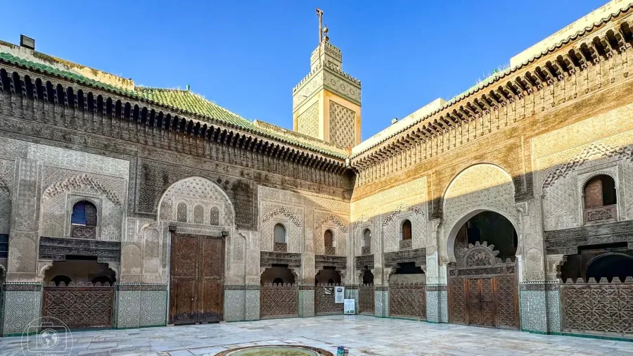 Ornately decorated courtyard of Bou Inania Madrasa in Fes