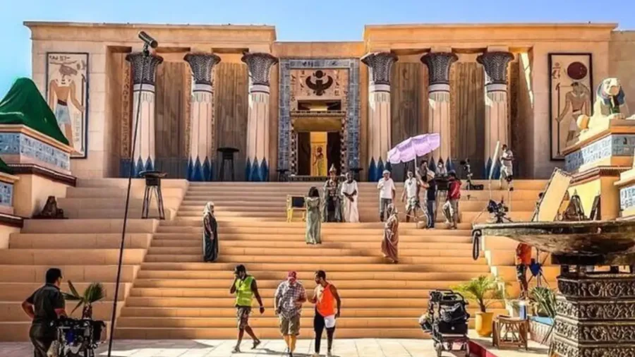 Visitors exploring an Egyptian-style temple set in Ouarzazate