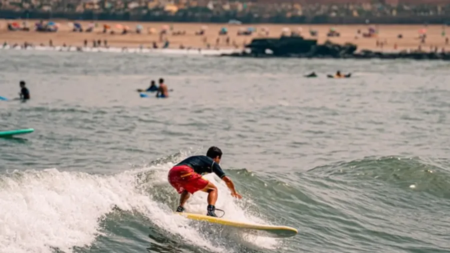 Surfer riding an Atlantic wave near Rabat and Sale
