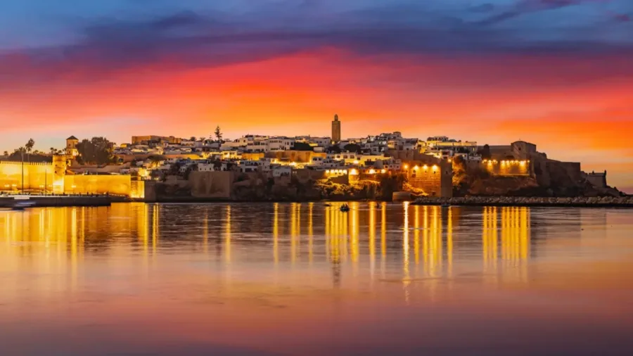 Kasbah of the Udayas illuminated at sunset beside the Bou Regreg River